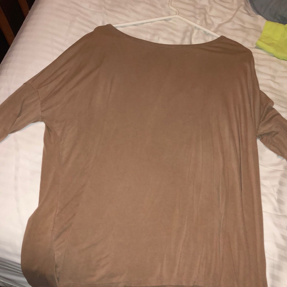 Never worn! small but can fit medium
